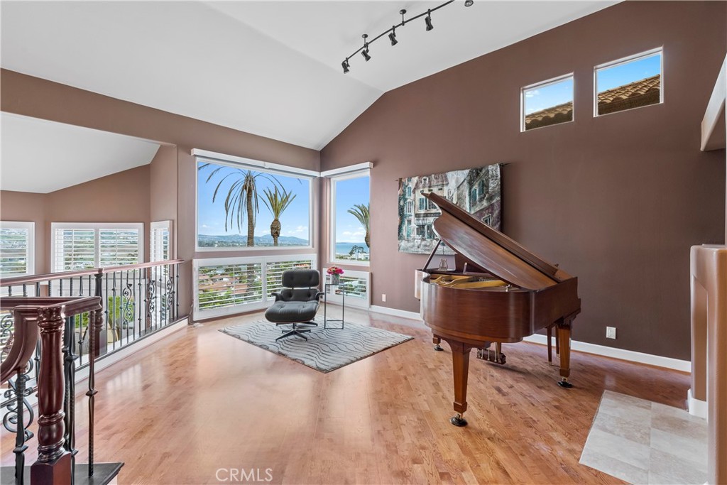 33662 Holtz Hill Drive Dana Point, CA 92629 - Photo 6 of 75 a living room with furniture and a floor to ceiling window