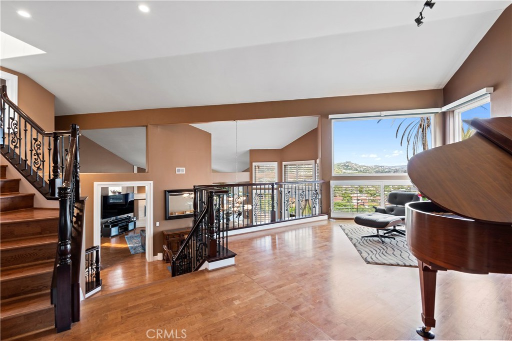 33662 Holtz Hill Drive Dana Point, CA 92629 - Photo 10 of 75 a living room with furniture gym equipment and a large window