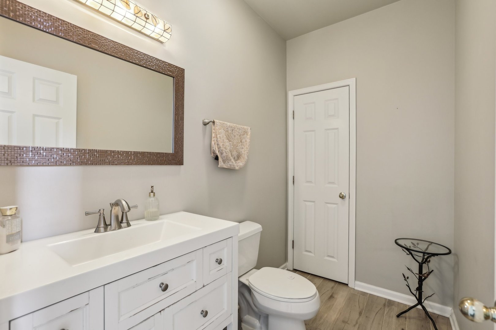 40783 Gridley Drive Antioch, IL 60002 - Photo 14 of 44 a bathroom with a sink a toilet and a mirror