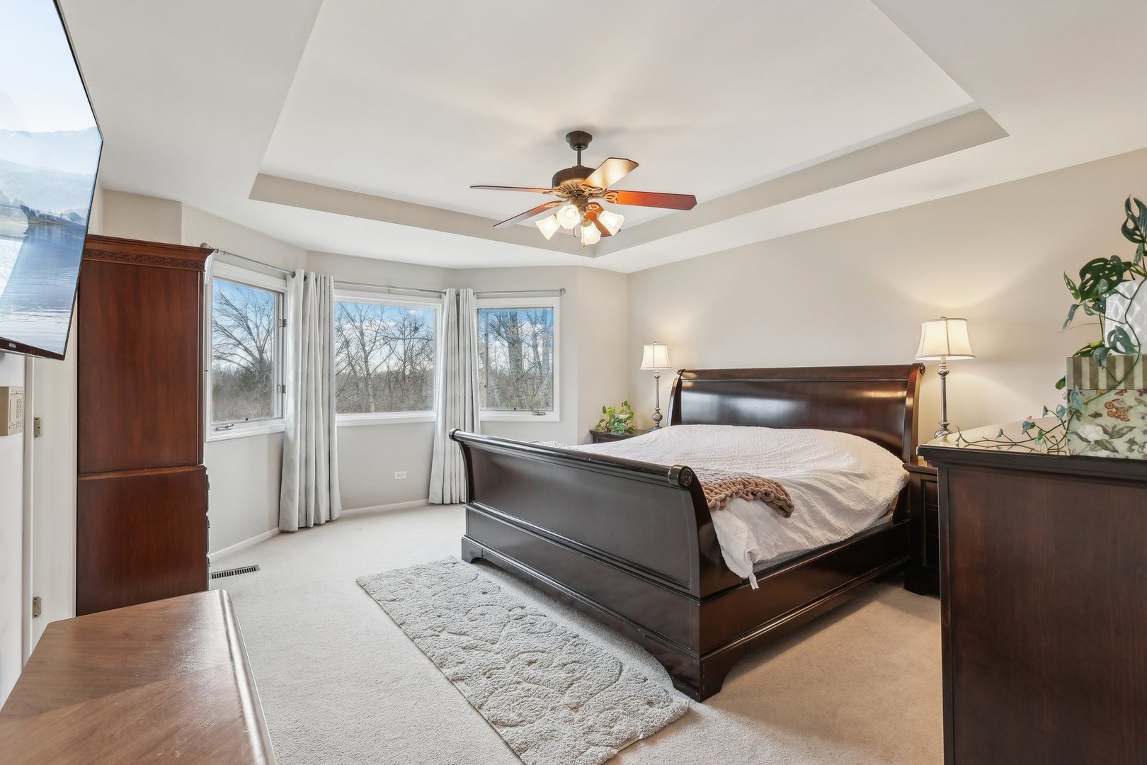 40783 Gridley Drive Antioch, IL 60002 - Photo 19 of 44 a bedroom with a bed and a chandelier