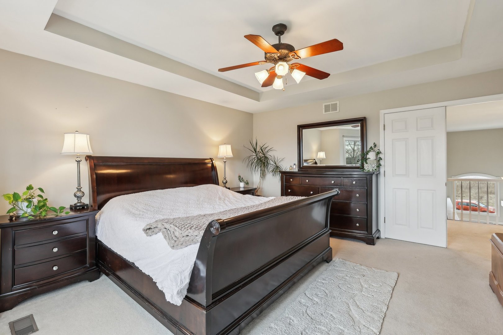 40783 Gridley Drive Antioch, IL 60002 - Photo 20 of 44 a bedroom with a bed and a chandelier