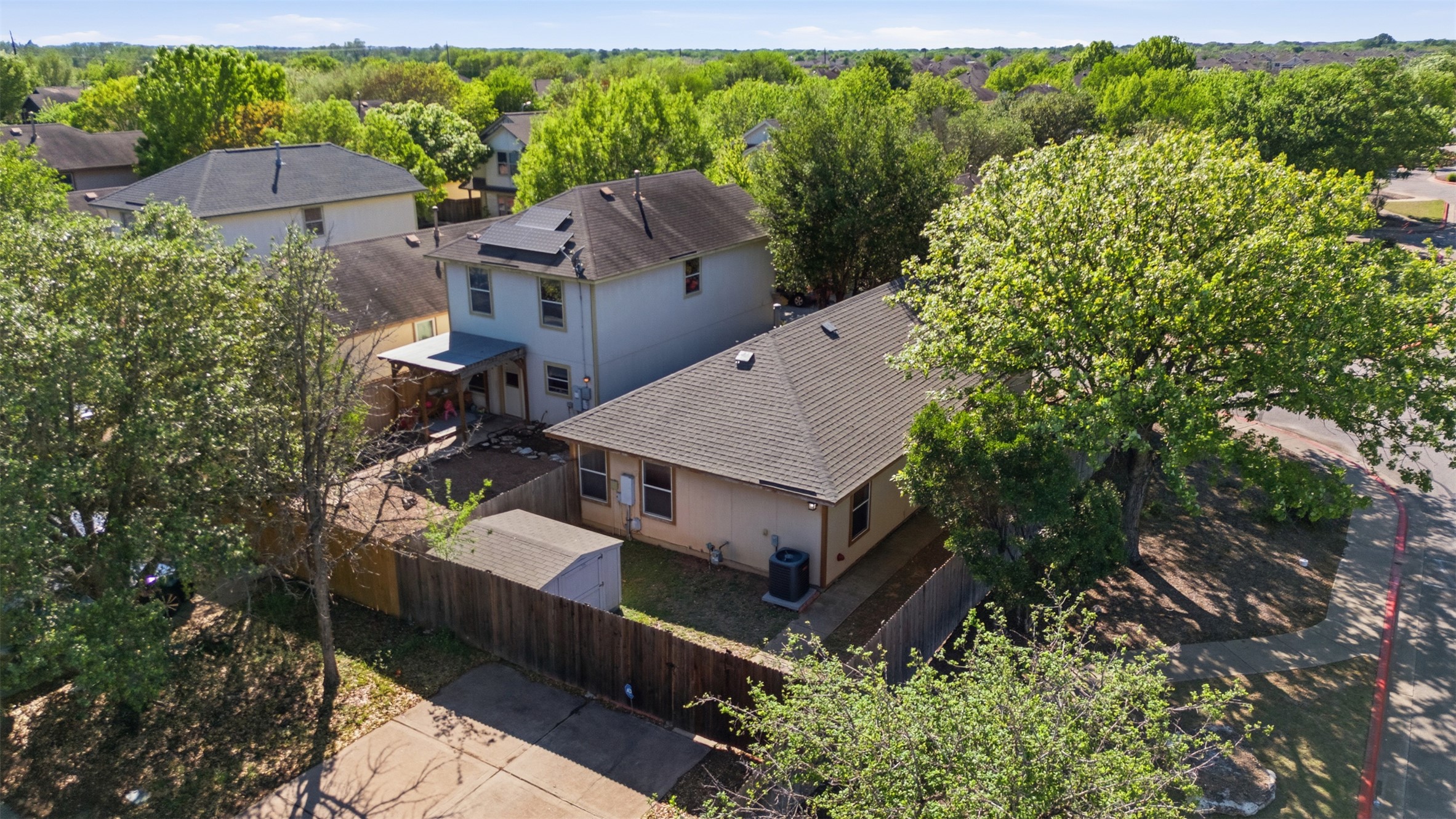 4529 Secure Lane, Unit 31 Austin, TX 78725 - Photo 29 of 38 an aerial view of a house with a yard basket ball court and outdoor seating