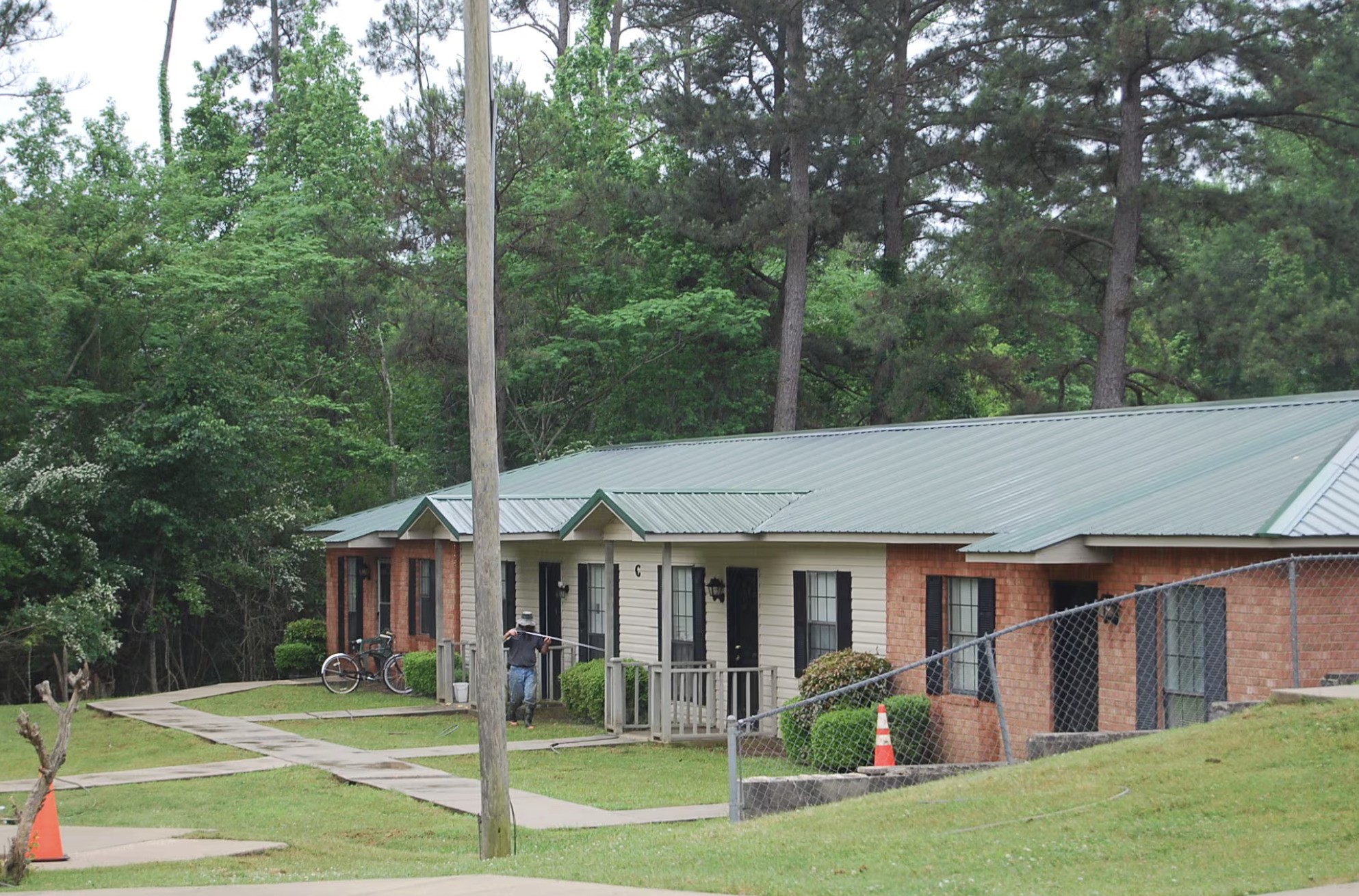 1015 Whiskey Run Road Camden, AL 36726 - Photo 2 of 6 a view of a white house with a big yard and large trees