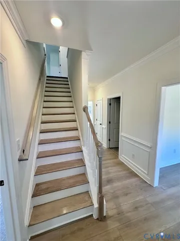 a view of an entryway with wooden floor