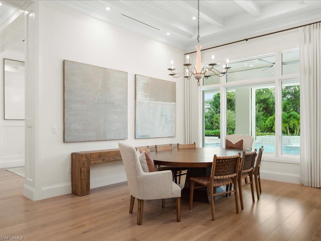 142 Eugenia Drive Naples, FL 34108 - Photo 12 of 35 a view of a dining room with furniture window and wooden floor