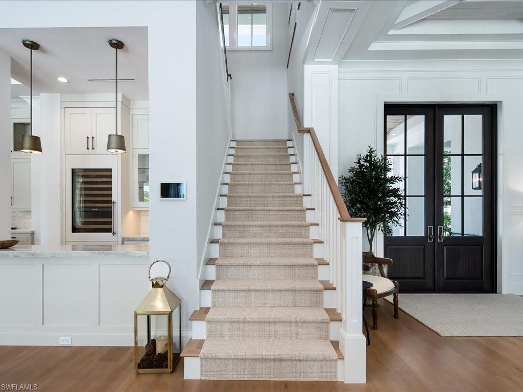 142 Eugenia Drive Naples, FL 34108 - Photo 13 of 35 a view of entryway and hall with wooden floor