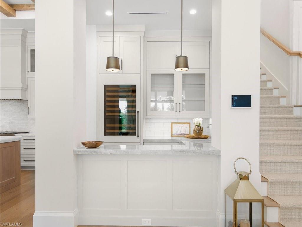 142 Eugenia Drive Naples, FL 34108 - Photo 14 of 35 a bathroom with a sink and mirror