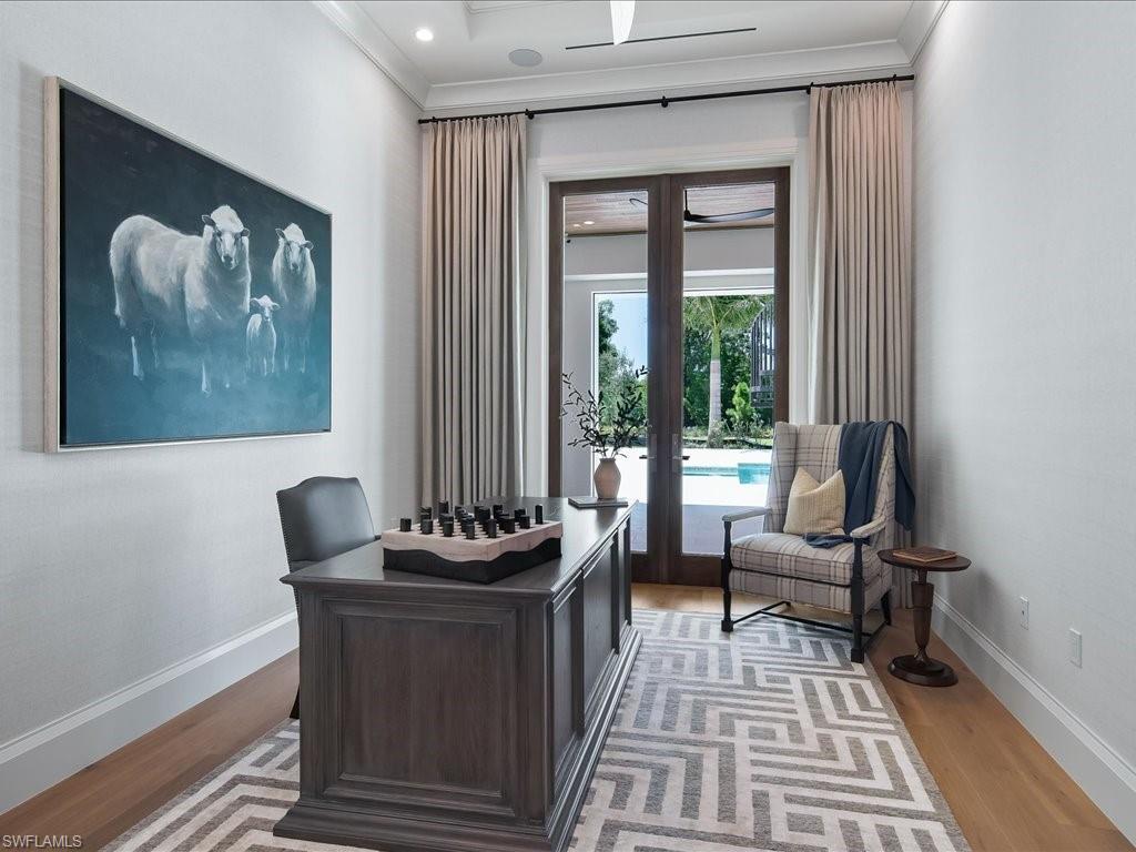 142 Eugenia Drive Naples, FL 34108 - Photo 19 of 35 a living room with furniture and a window
