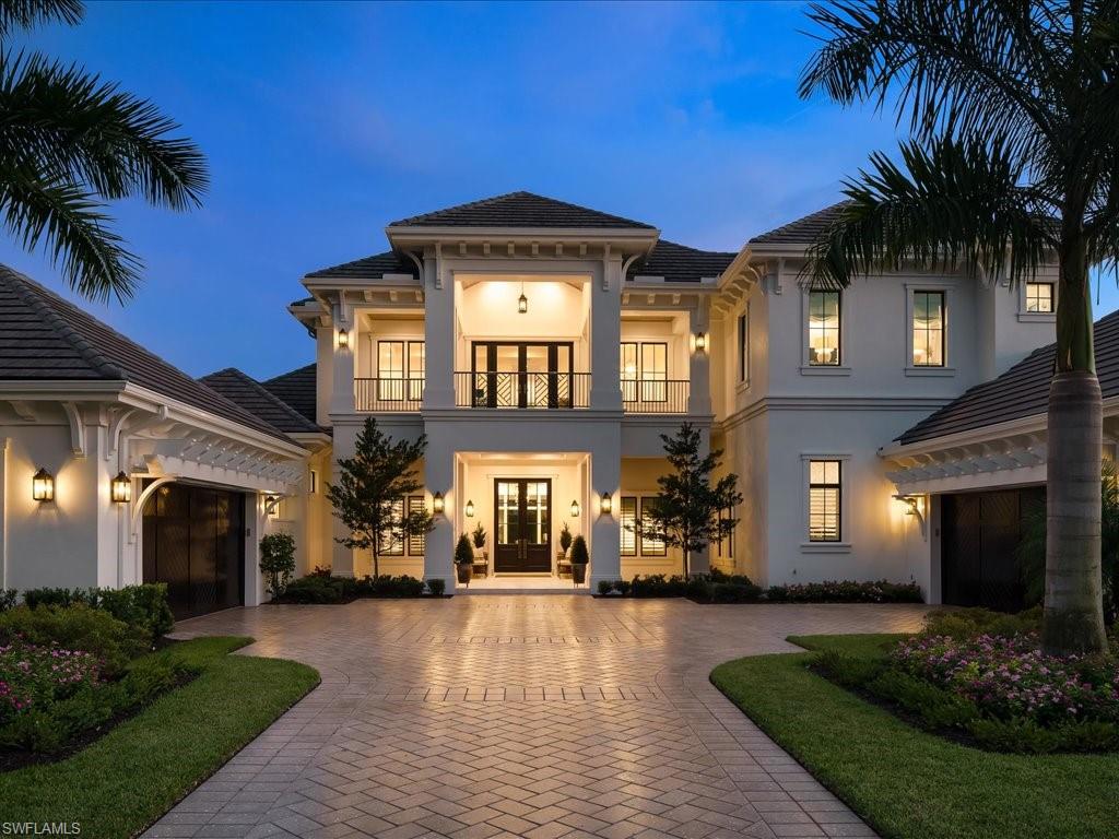 142 Eugenia Drive Naples, FL 34108 - Photo 2 of 35 a front view of a house with a yard