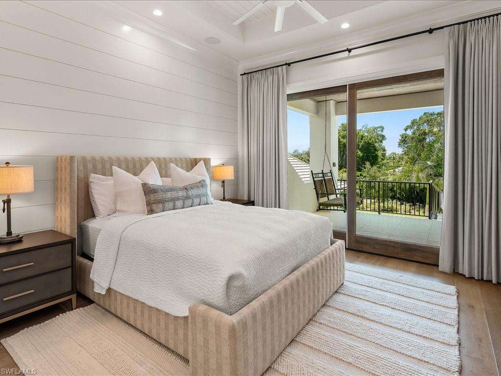 142 Eugenia Drive Naples, FL 34108 - Photo 24 of 35 a bed sitting in a bedroom next to a window