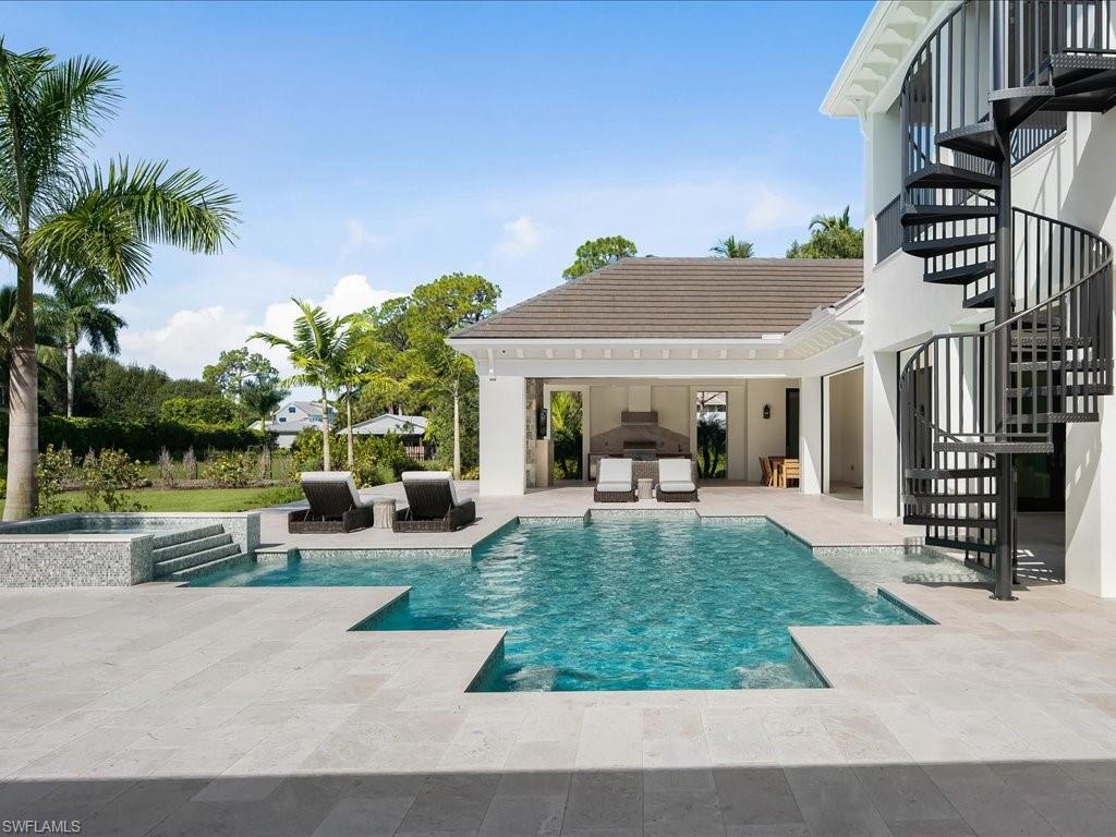 142 Eugenia Drive Naples, FL 34108 - Photo 28 of 35 a view of a house with sitting area and garden