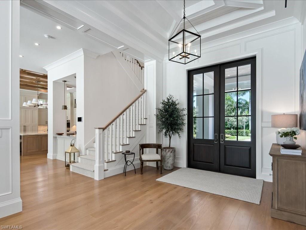 142 Eugenia Drive Naples, FL 34108 - Photo 5 of 35 a view of entryway and hall with wooden floor