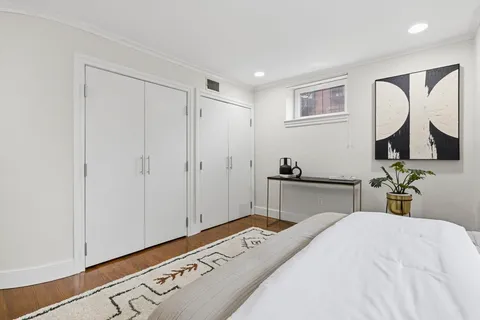 a bedroom with a bed and a mirror