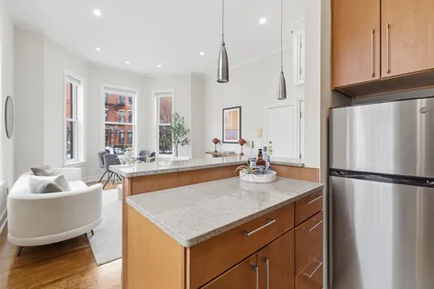 a kitchen with a refrigerator a sink and a refrigerator
