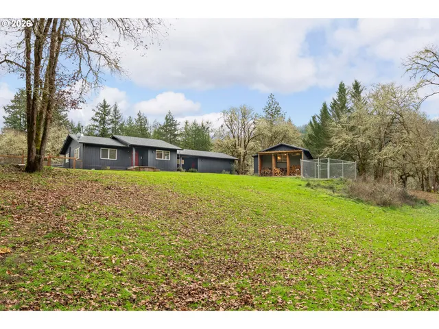 a house with swimming pool in front of it