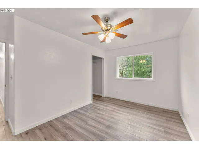 a bathroom with a sink a toilet a shower and a mirror