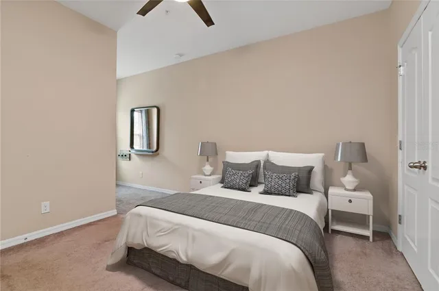 a view of a big room with a big yard and large tree