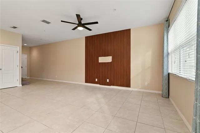 an aerial view of a house with a garden and swimming pool