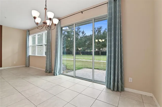 an aerial view of a house with garden space and street view