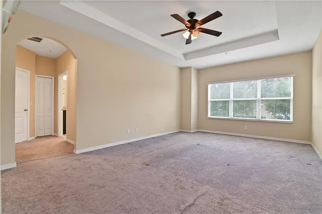 a view of a swimming pool with a yard