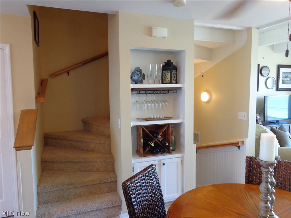 28 D Cedar Point Road Sandusky, OH 44870 - Photo 7 of 27 Built in area in the dining room, steps on the left to go the second floor.