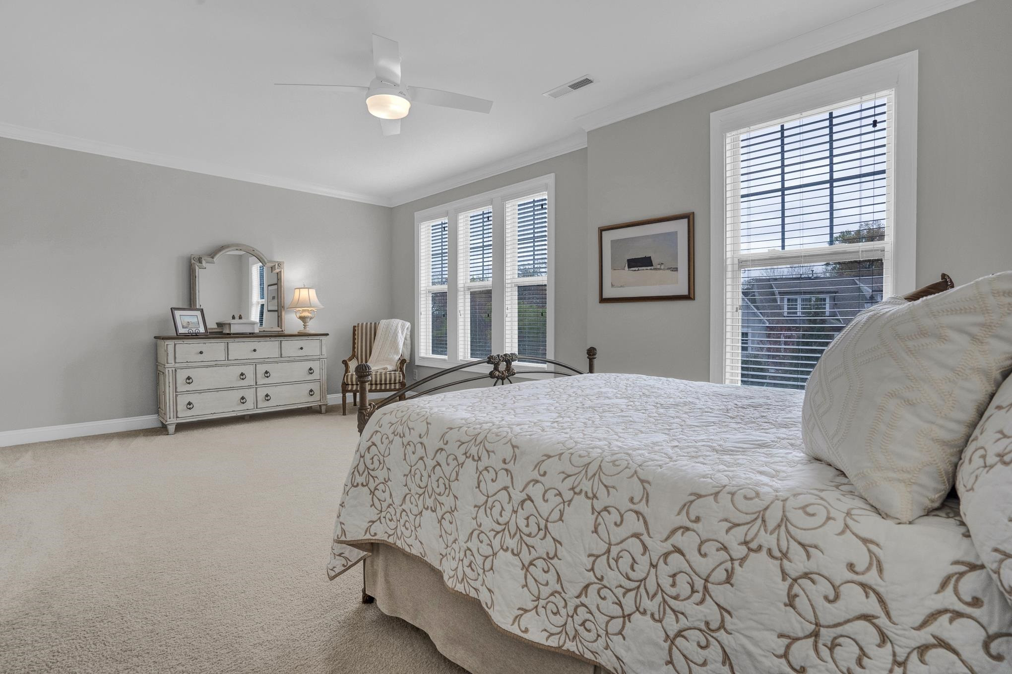 712 Fallon Grove Way Raleigh, NC 27608 - Photo 12 of 20 a spacious bedroom with a bed and a window