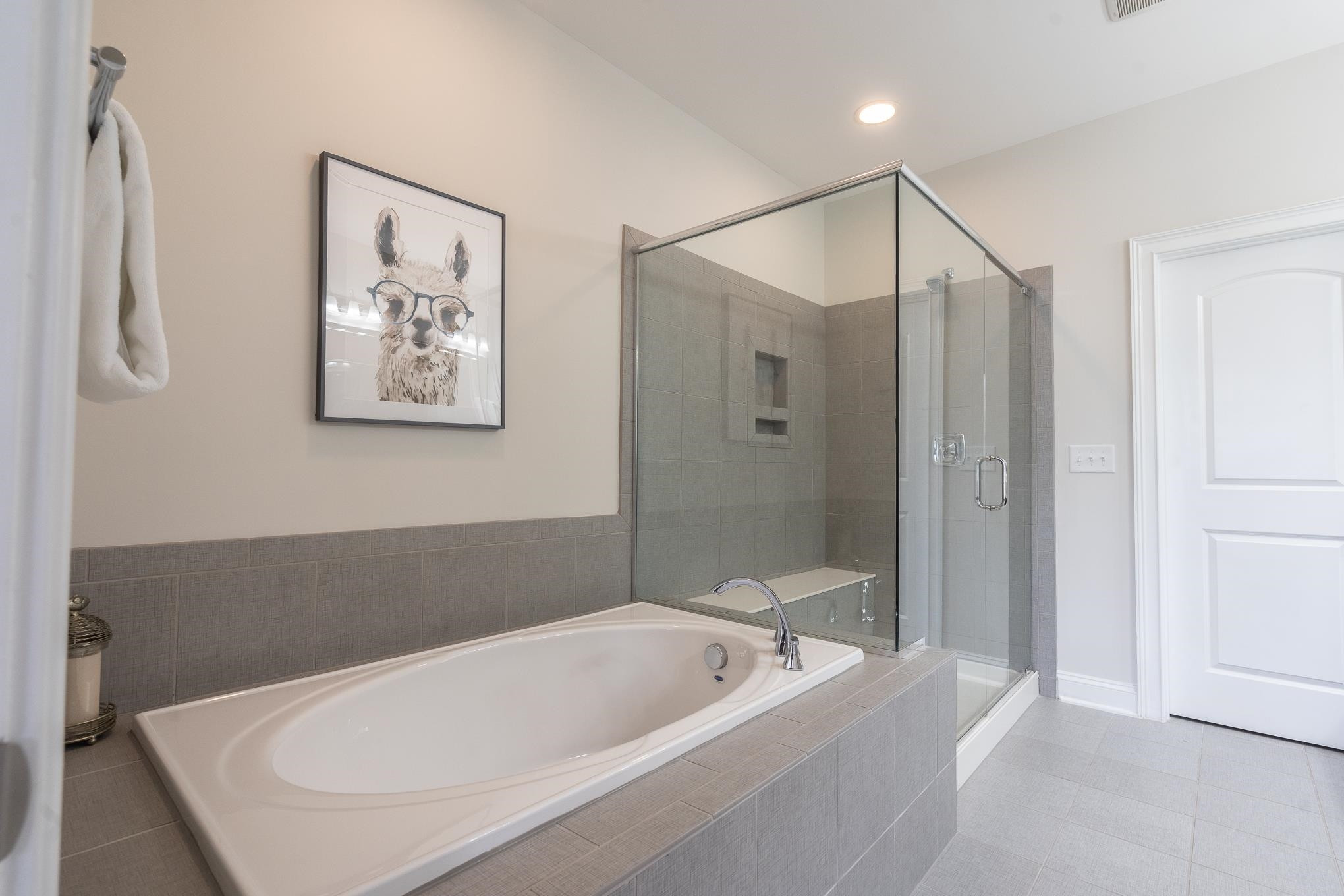 712 Fallon Grove Way Raleigh, NC 27608 - Photo 14 of 20 a bathroom with a tub a shower and a sink