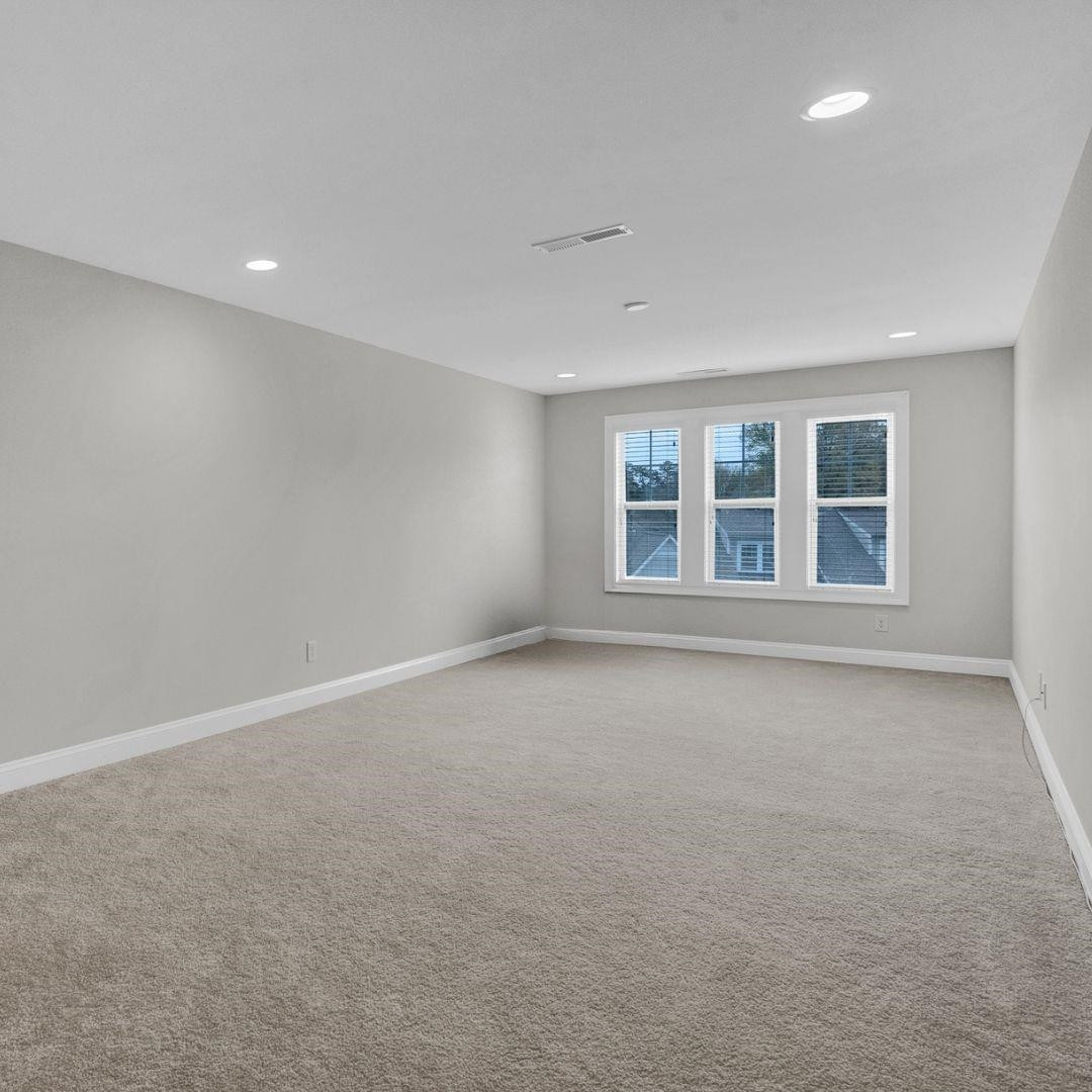 712 Fallon Grove Way Raleigh, NC 27608 - Photo 18 of 20 a view of an empty room with a window
