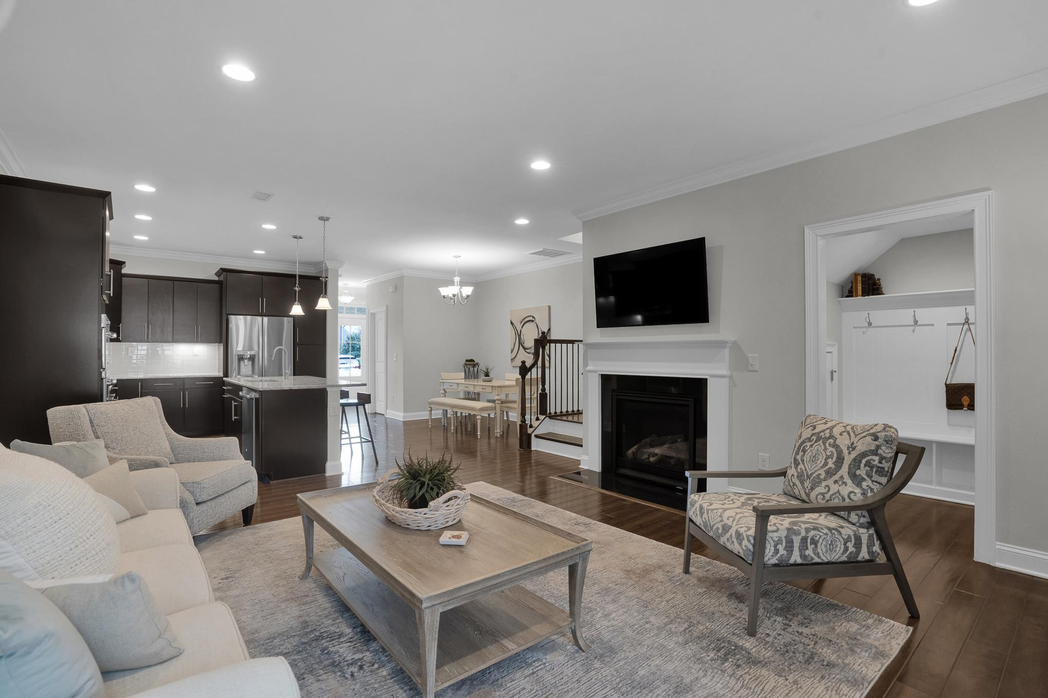 712 Fallon Grove Way Raleigh, NC 27608 - Photo 7 of 20 a living room with furniture a fireplace and a flat screen tv