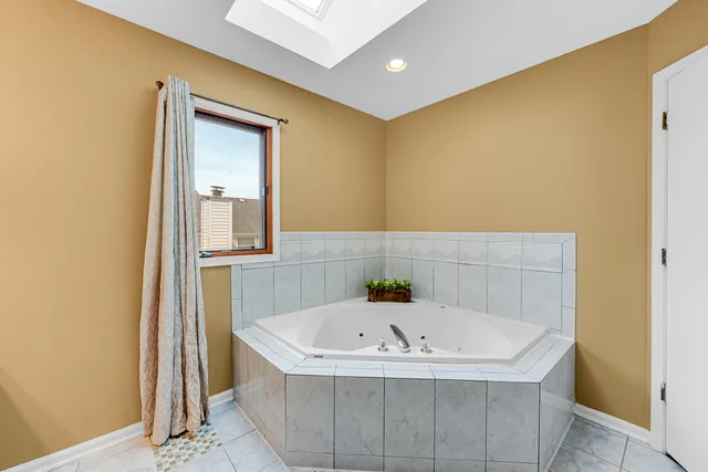 a bathroom with a tub and shower