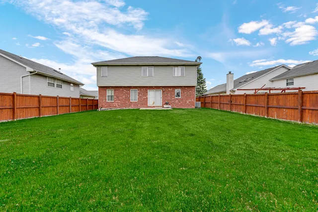 a view of a backyard with a garden and plants