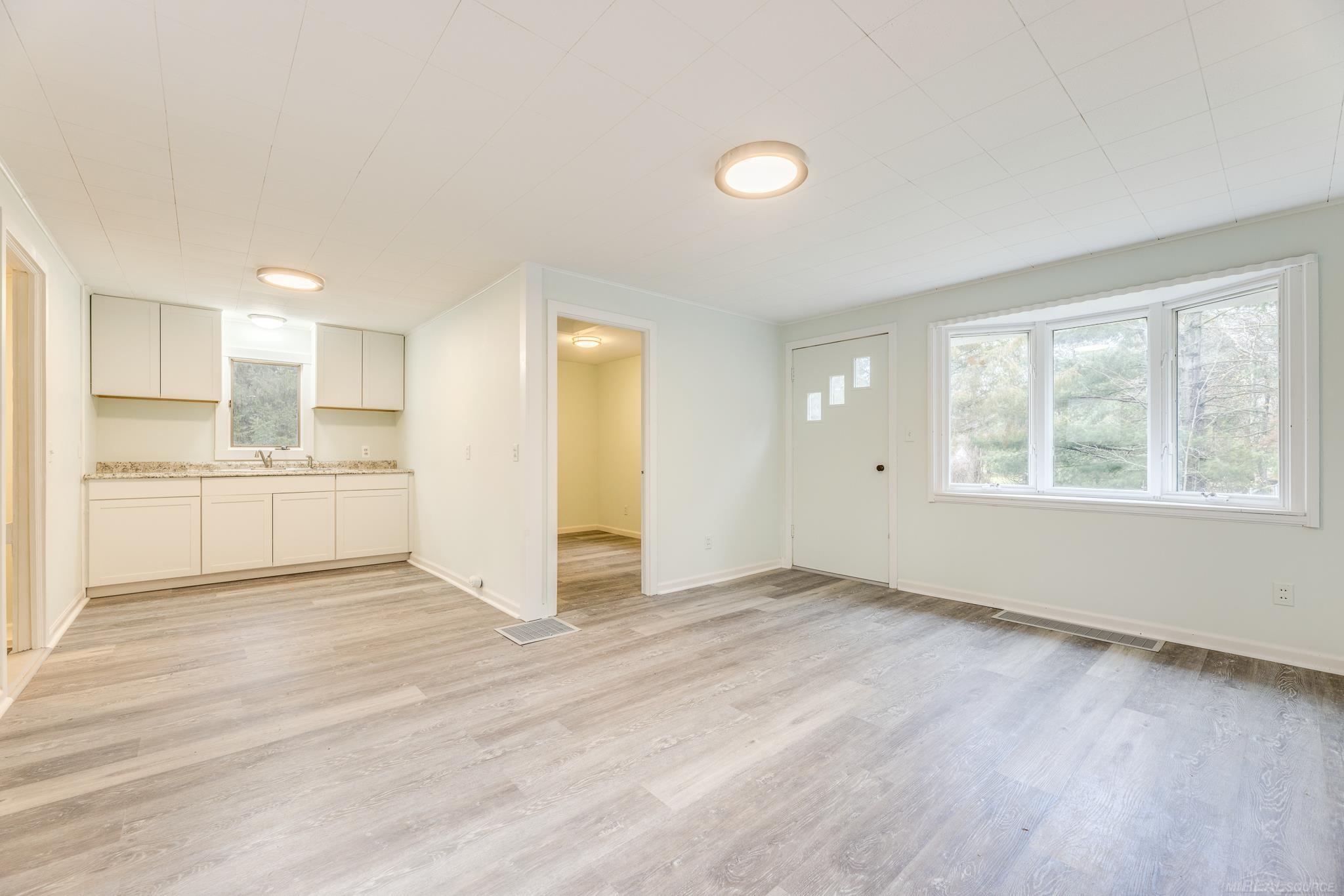 7340 Hawthorne Road Lexington, MI 48450 - Photo 7 of 32 Living Room looking into the Kitchen