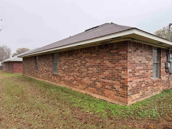 a view of a storage and utility room with washer and dryer