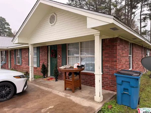 a brick house with a sink and a yard
