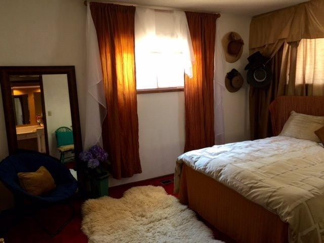 502 West Hilltop Road Talent, OR 97540 - Photo 21 of 34 a bedroom with a bed dresser and mirror
