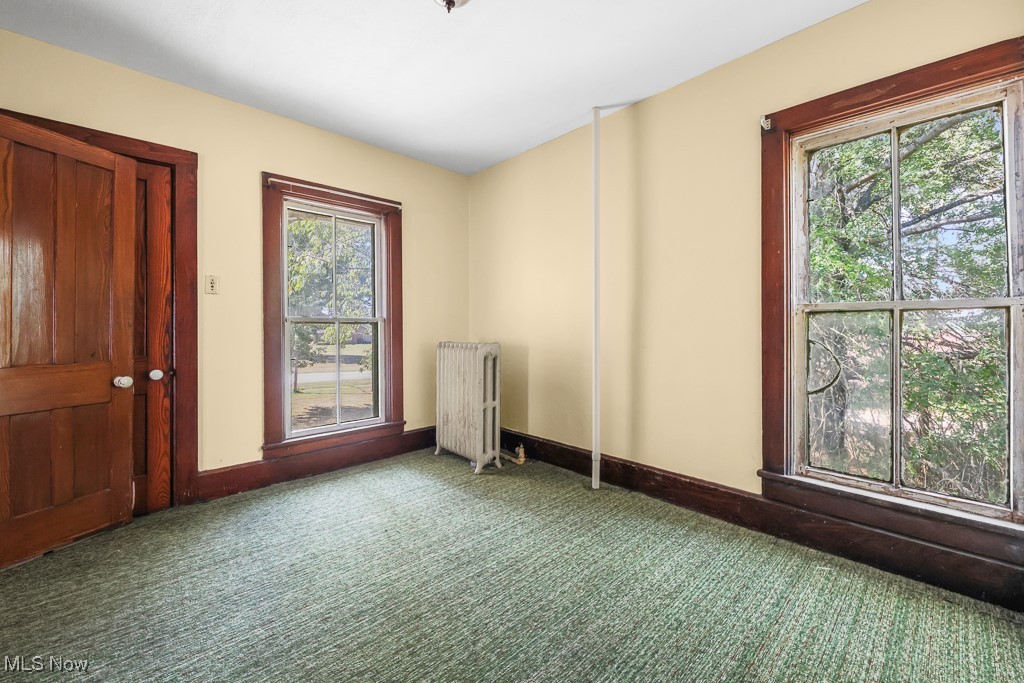 6727 Waterloo Road Atwater, OH 44201 - Photo 32 of 48 Spare room with carpet floors and radiator