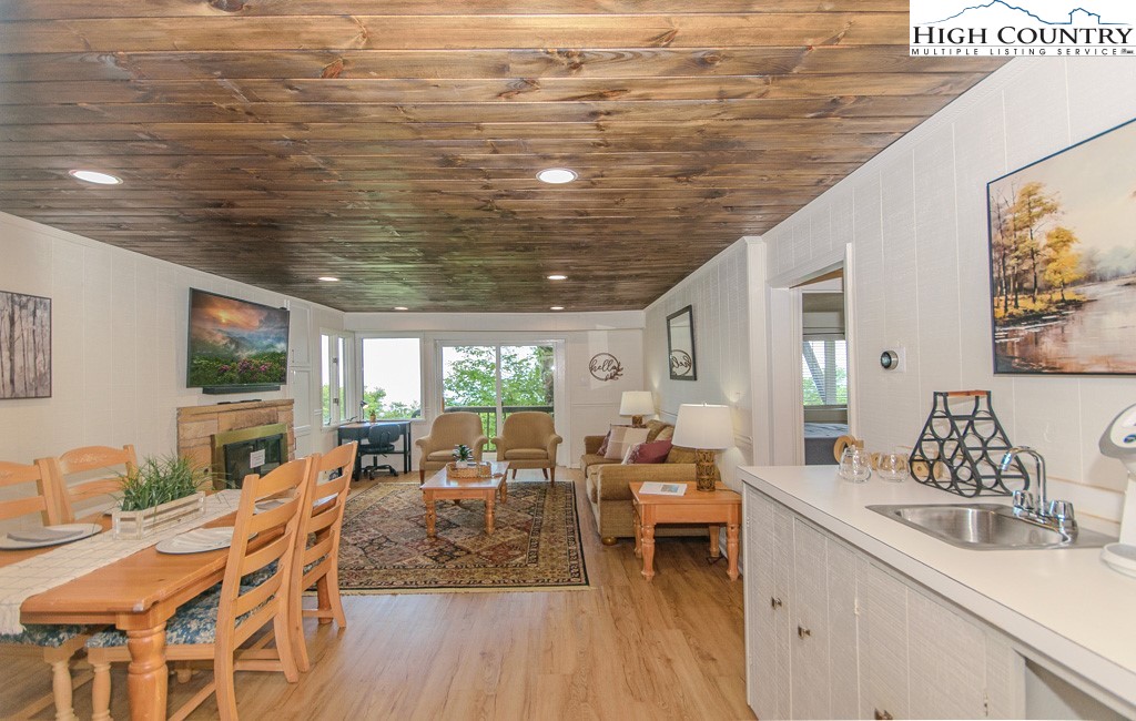 220 Northridge Road, Unit 25 Beech Mountain, NC 28604 - Photo 11 of 47 a view of a dining room with furniture window and outside view