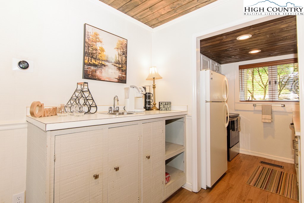 220 Northridge Road, Unit 25 Beech Mountain, NC 28604 - Photo 16 of 47 a kitchen with a refrigerator and a stove