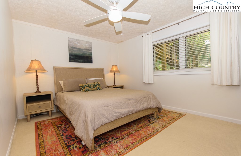 220 Northridge Road, Unit 25 Beech Mountain, NC 28604 - Photo 25 of 47 a bedroom with bed and window