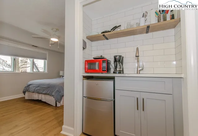 a bathroom with a toilet a sink and shower