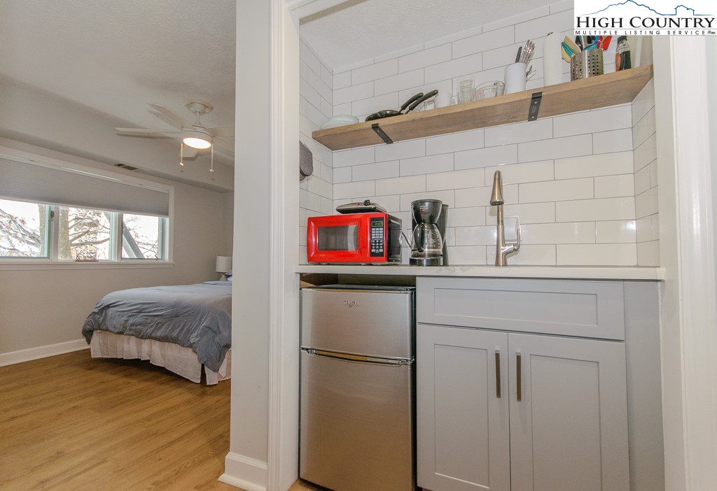 220 Northridge Road, Unit 25 Beech Mountain, NC 28604 - Photo 27 of 47 a kitchen with a refrigerator and window
