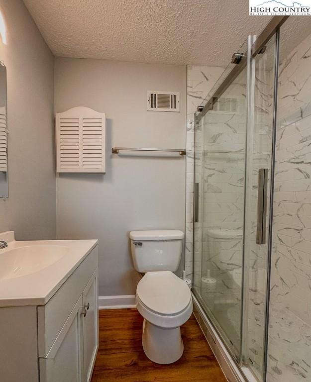 220 Northridge Road, Unit 25 Beech Mountain, NC 28604 - Photo 31 of 47 a bathroom with a toilet a sink and shower