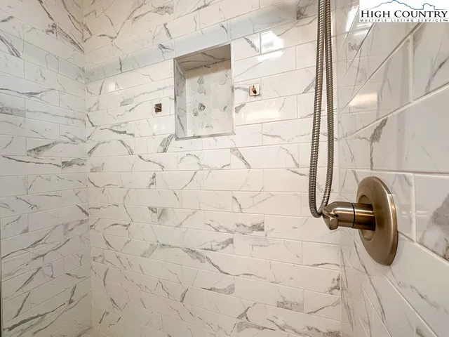 a view of balcony with wooden floor