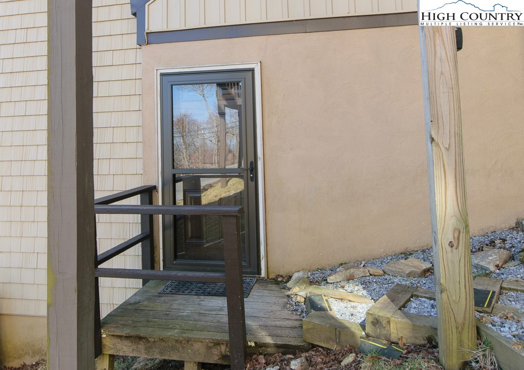 220 Northridge Road, Unit 25 Beech Mountain, NC 28604 - Photo 42 of 47 a bedroom with a bed and a window