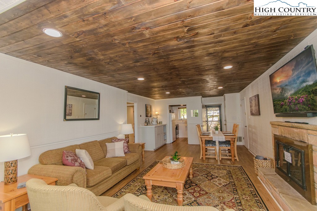220 Northridge Road, Unit 25 Beech Mountain, NC 28604 - Photo 7 of 47 a living room with furniture and a fireplace