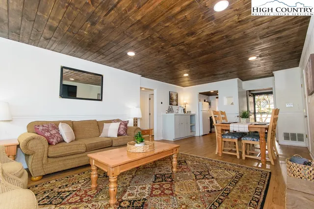 a living room with furniture and a rug