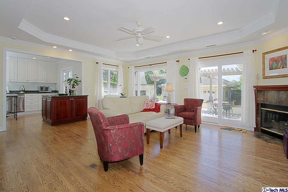 3690 Newhaven Road Pasadena, CA 91107 - Photo 12 of 21 a living room with fireplace furniture and a wooden floor