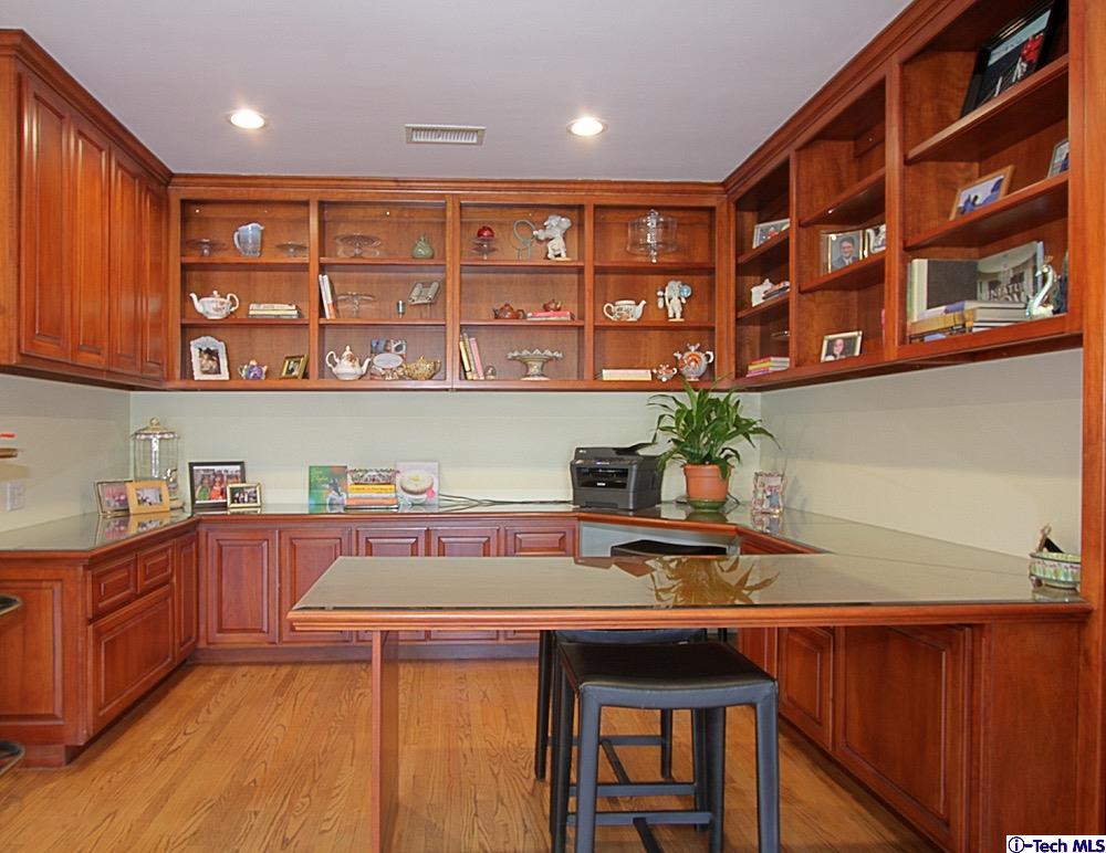 3690 Newhaven Road Pasadena, CA 91107 - Photo 14 of 21 a kitchen with stainless steel appliances granite countertop a sink and wooden cabinets