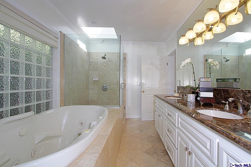 3690 Newhaven Road Pasadena, CA 91107 - Photo 16 of 21 a bathroom with a granite countertop sink mirror and a bathtub