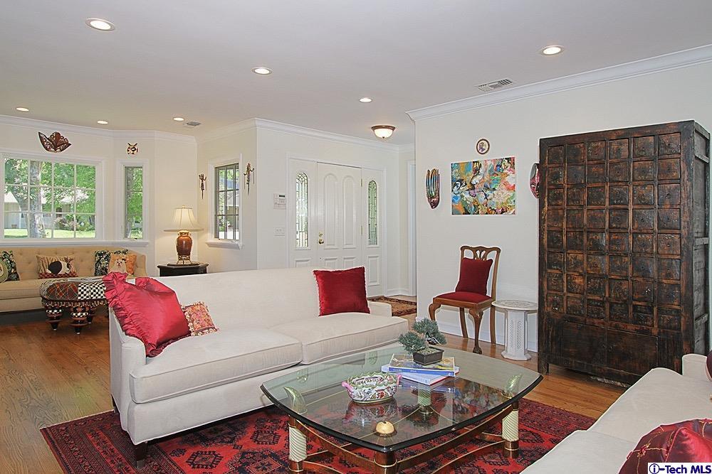 3690 Newhaven Road Pasadena, CA 91107 - Photo 5 of 21 a living room with furniture a rug and a table